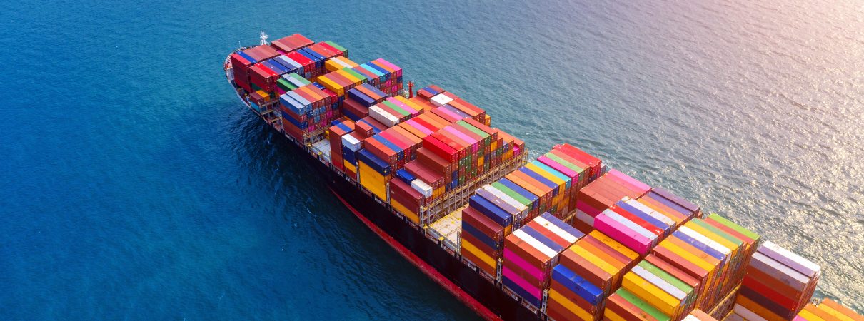 Aerial view of container cargo ship in sea.